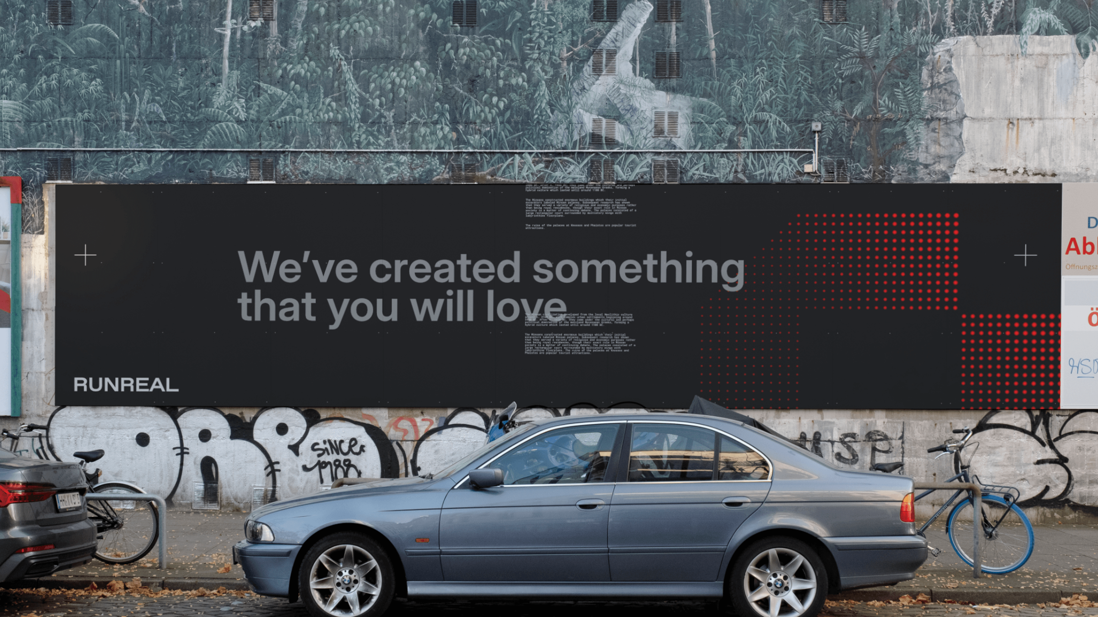Urban billboard mockup for Runreal with the headline “We’ve created something that you will love” on a dark background with red data-like dots, designed by Kundo Studio to showcase the tech-forward brand identity and out-of-home campaign.}