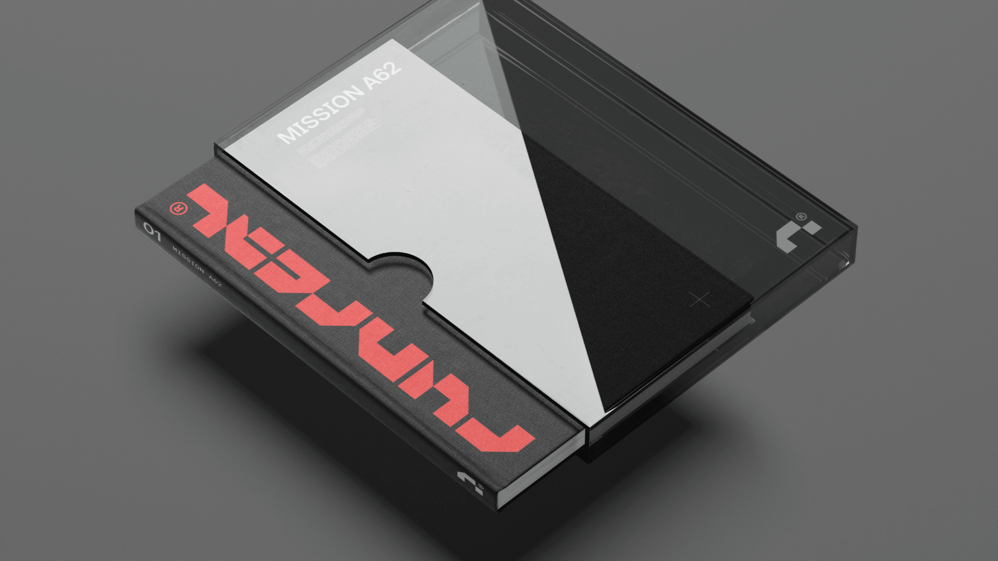 Minimal 3D mockup of a Runreal “Mission A62” book and clear case with bold red wordmark, designed by Kundo Studio to showcase the tech-forward brand identity, print design, and packaging system.