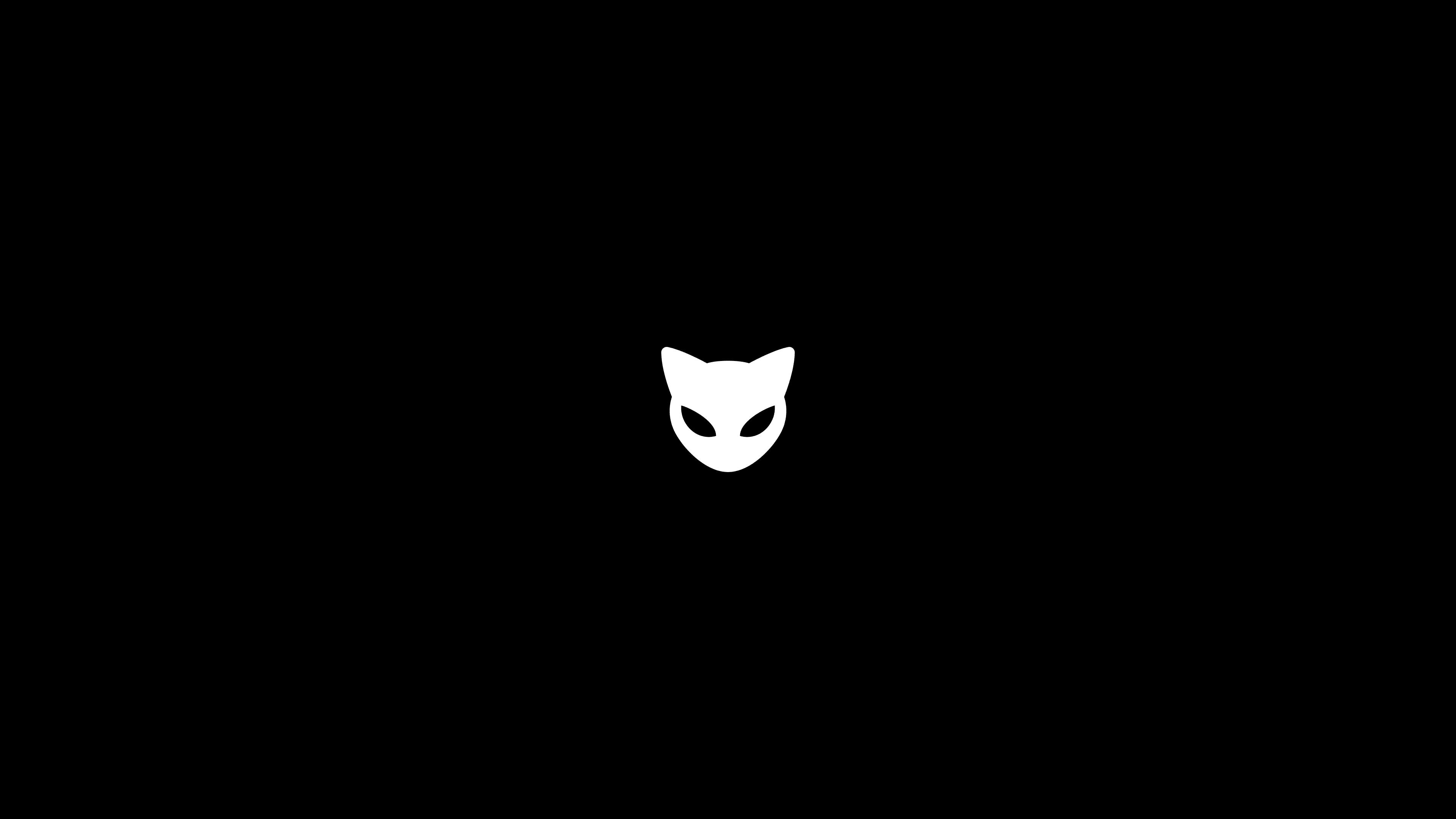 Centered white MEOW cat-head logo on a black background, designed by Kundo Studio as the core playful icon for the MEOW crypto brand and retro-inspired website.